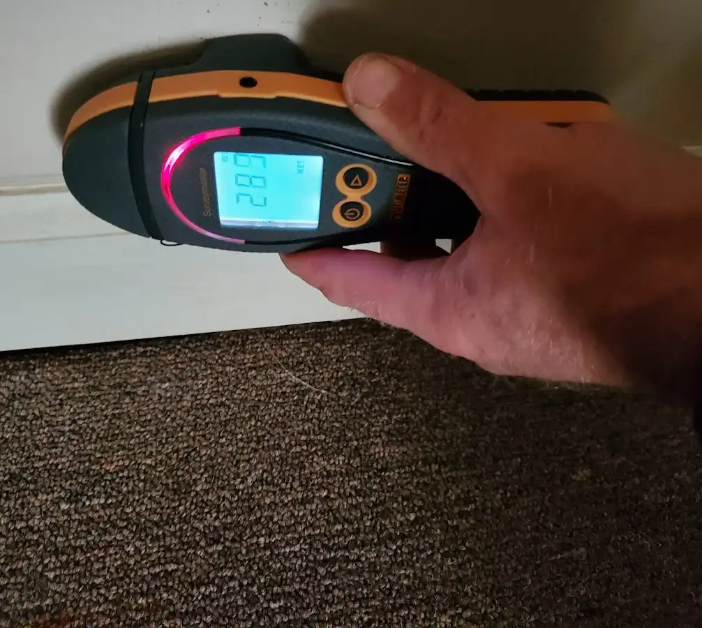 Moisture detection at baseboard during Storm Damage Restoration in Dunmore